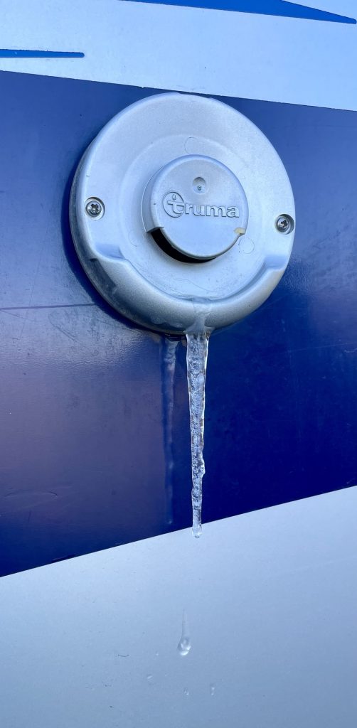 Icicle hanging from heat vent